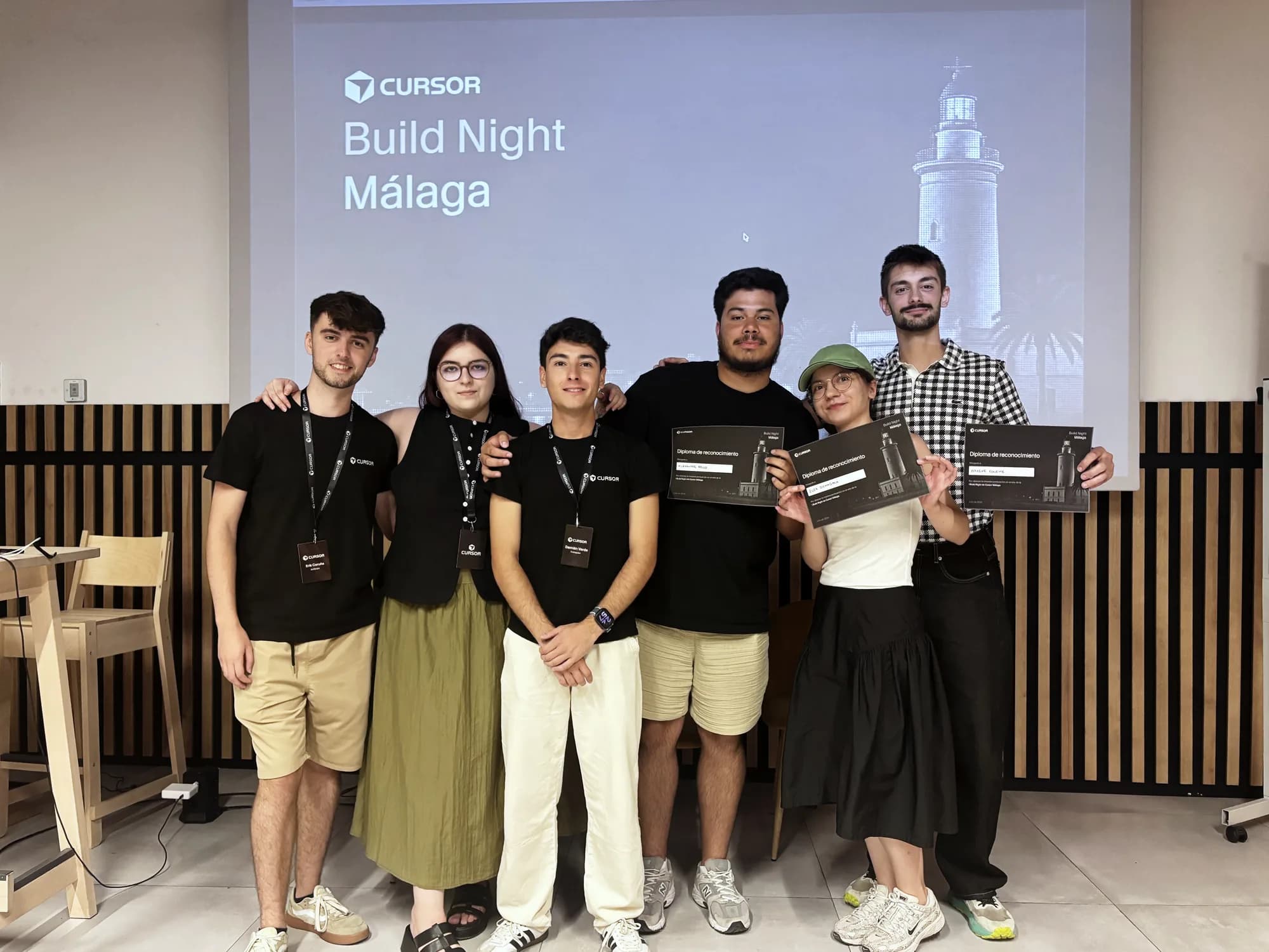 Build Night winners holding their diplomas with the organizers
